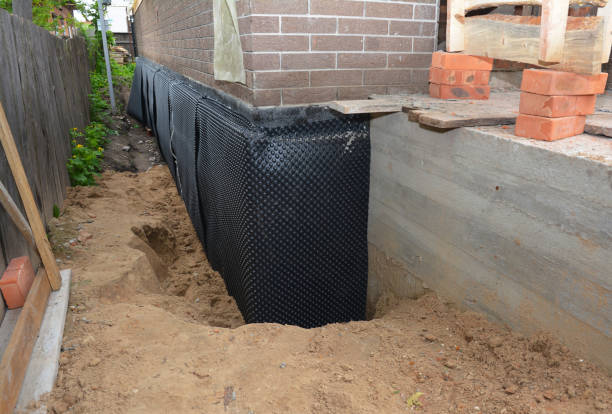 SJ Waterproofing Pros technician performing targeted Waterproofing assessment in Garden City, MI